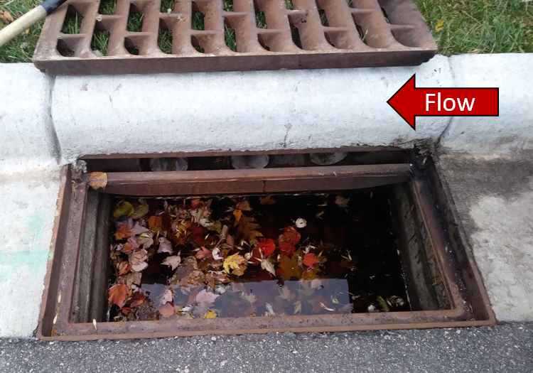 Figure 2. Shallow sump pretreatment with surface grate removed. This photo was taken upon arrival at the site, before cleaning the sump in preparation for testing.